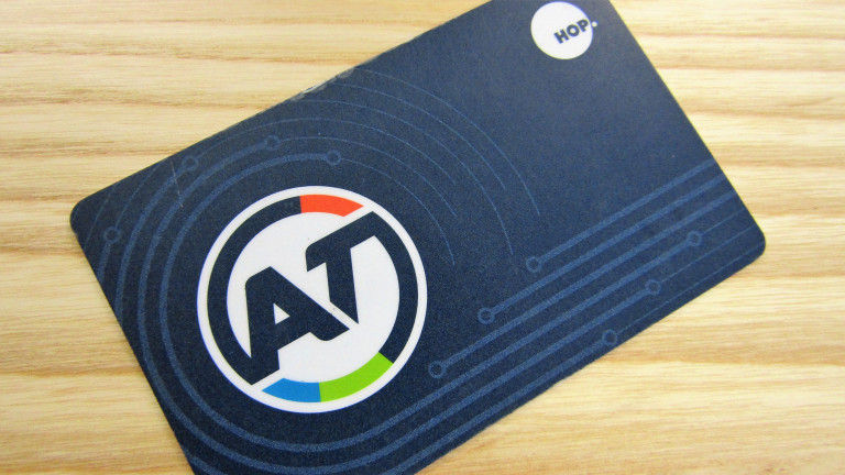 A close-up view of an Auckland Transport HOP card on a table.  